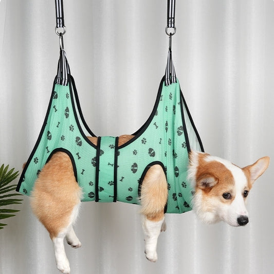 Dog Grooming Hammock Harness with paw pattern against a white curtain background