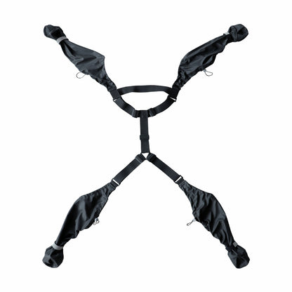 Black suspender dog boots harness with multiple straps on a white background