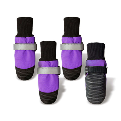 Set of four purple and black dog boots with reflective straps on a white background