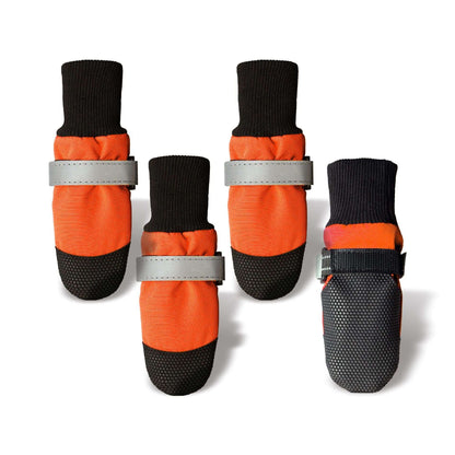 Set of four orange and black pet boots with reflective straps on a white background