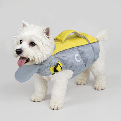 Small white dog wearing a gray and yellow life jacket on a light gray background