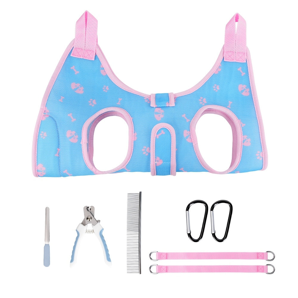 Pet Grooming Hammock Harness kit with blue and pink harness, clippers, comb, and leashes on a white background